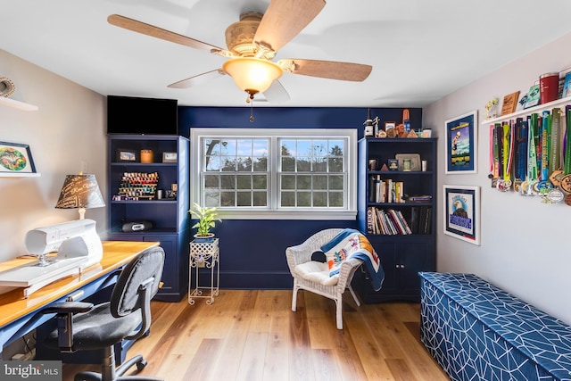 office with ceiling fan and light wood-type flooring