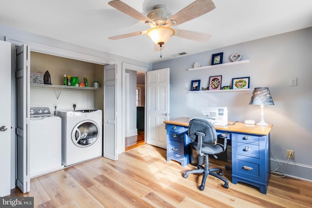 home office with ceiling fan, independent washer and dryer, and light hardwood / wood-style flooring