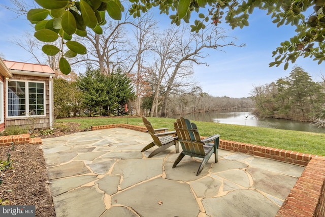 view of patio / terrace featuring a water view