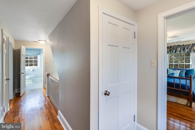 hall with hardwood / wood-style floors