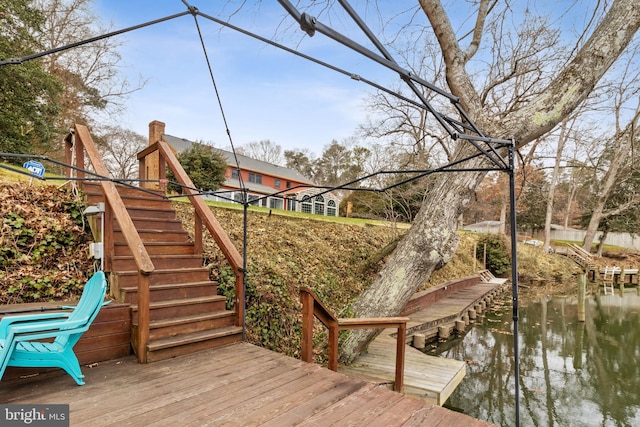 exterior space with a deck with water view