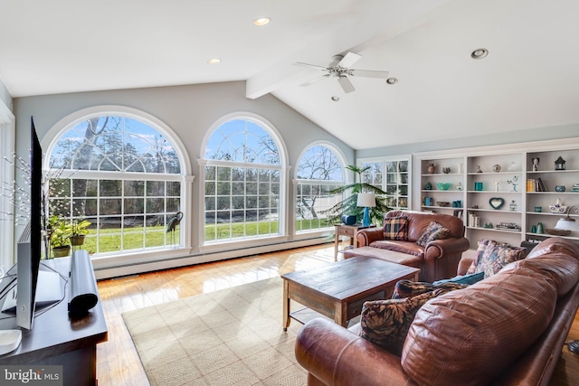 living room featuring lofted ceiling with beams, ceiling fan, light hardwood / wood-style floors, and baseboard heating