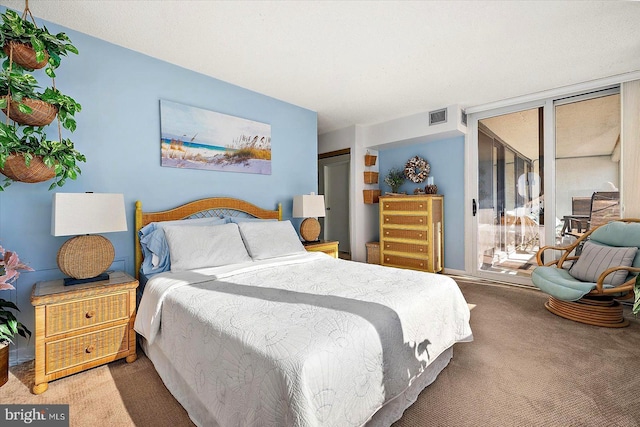 bedroom featuring a wall of windows and carpet flooring