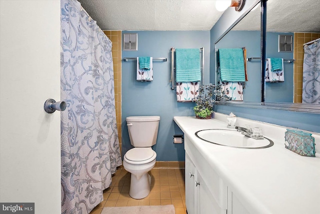 bathroom with toilet, a textured ceiling, a shower with curtain, tile patterned floors, and vanity