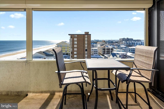 balcony with a view of the beach and a water view