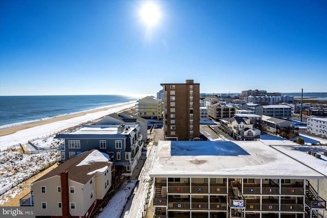 birds eye view of property featuring a water view and a view of the beach