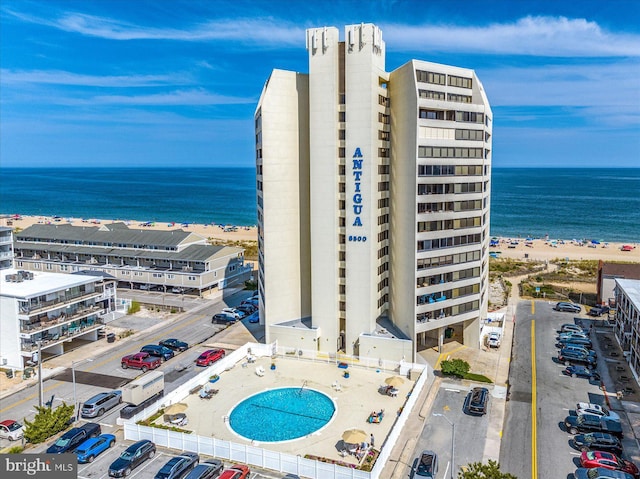 bird's eye view with a beach view and a water view