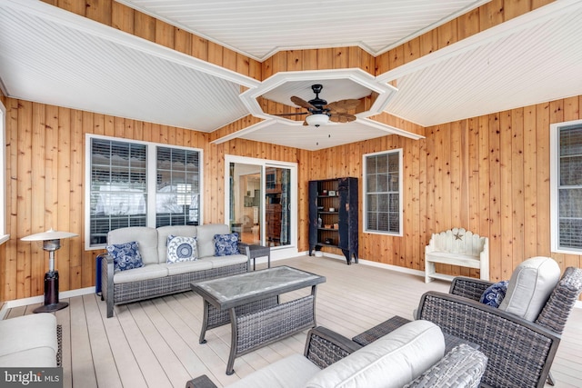 deck with an outdoor living space and a ceiling fan