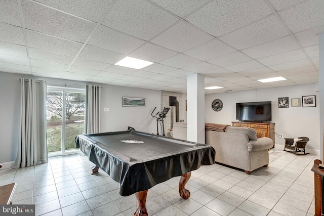 game room with pool table, light tile patterned flooring, a paneled ceiling, and baseboards