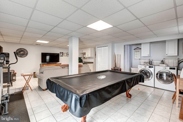 rec room with washer and clothes dryer, pool table, a paneled ceiling, and light tile patterned flooring