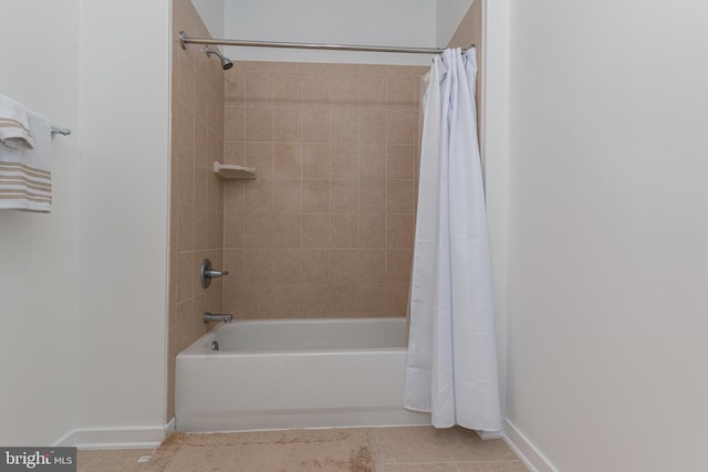 bathroom featuring tile patterned flooring and shower / bath combination with curtain