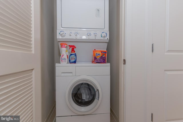 laundry area with stacked washer / drying machine