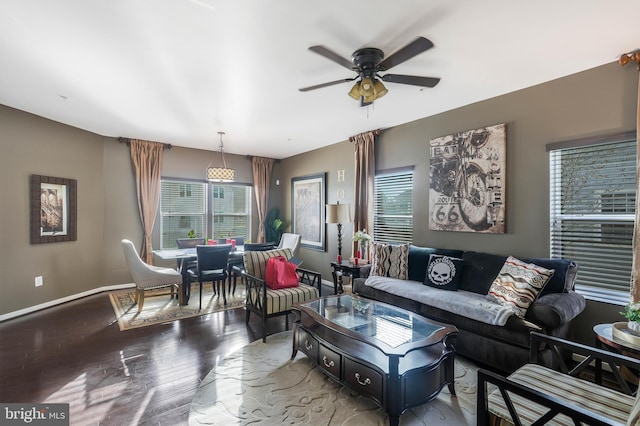 living room featuring hardwood / wood-style floors and ceiling fan