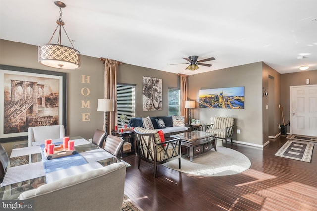 living room featuring ceiling fan and wood-type flooring