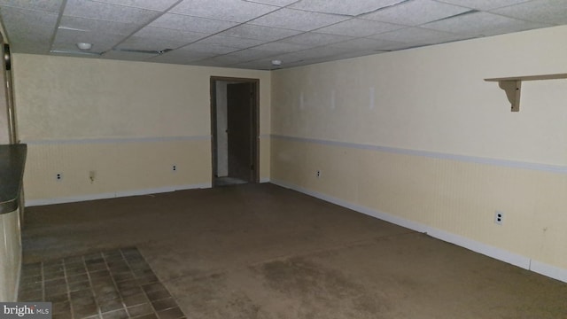 basement featuring a drop ceiling