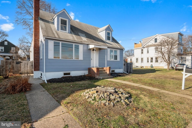 cape cod-style house with a front lawn