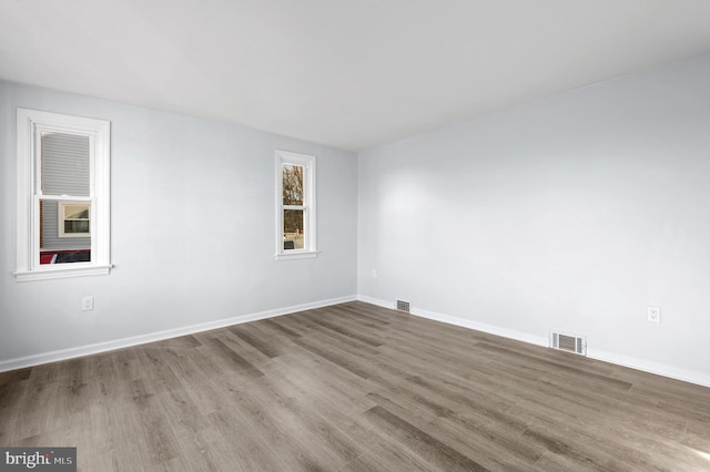 spare room featuring hardwood / wood-style flooring