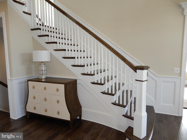 staircase with wood-type flooring