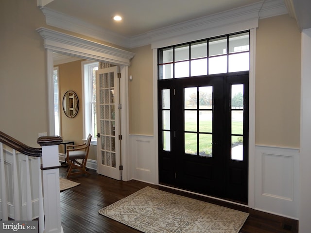 foyer featuring dark hardwood / wood-style floors and ornamental molding