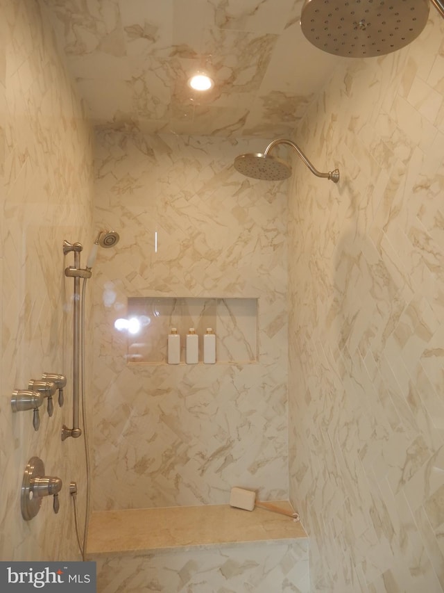 bathroom with a tile shower