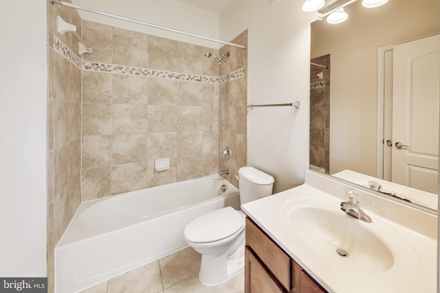 full bathroom with tile patterned flooring, vanity, toilet, and tiled shower / bath