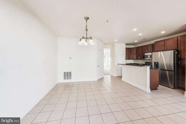 kitchen featuring stainless steel appliances, an inviting chandelier, pendant lighting, dark brown cabinets, and light tile patterned floors