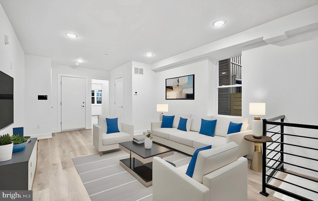 living room with light hardwood / wood-style floors