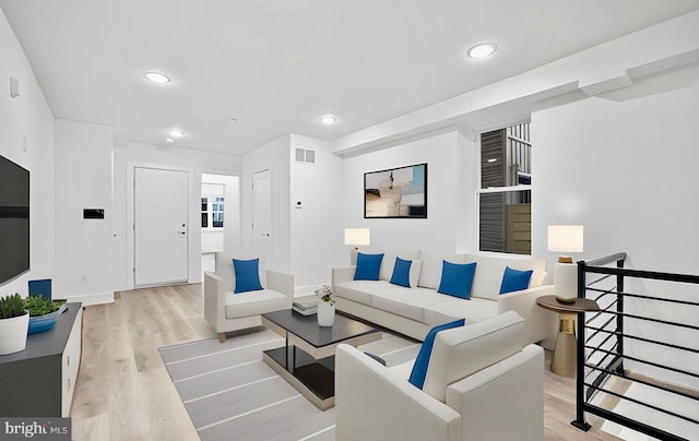 living room with light hardwood / wood-style floors