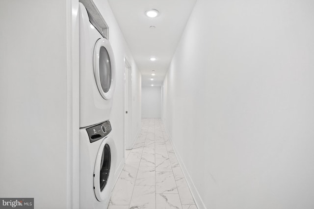 laundry area with stacked washer / drying machine