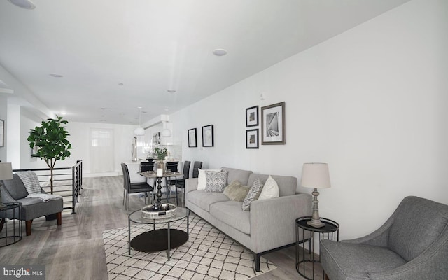 living room with light hardwood / wood-style flooring