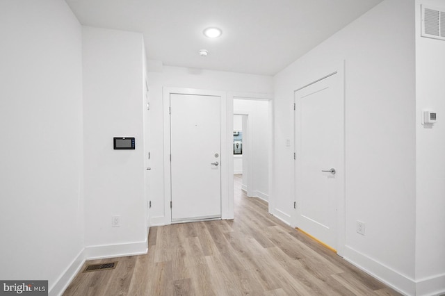 corridor featuring light hardwood / wood-style flooring