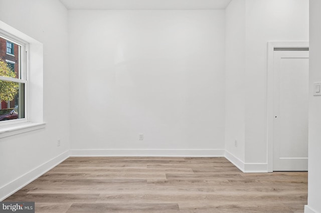 spare room with light wood-type flooring