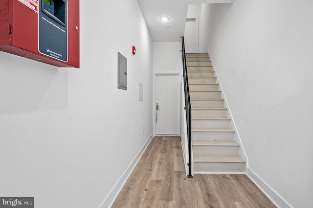 staircase featuring hardwood / wood-style floors