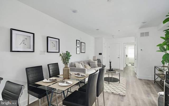 dining room with light wood-type flooring