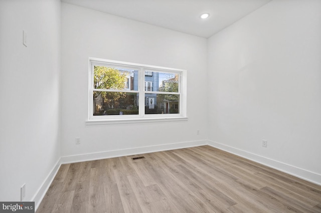 spare room with light hardwood / wood-style floors