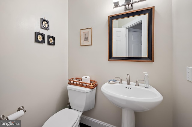 bathroom featuring sink and toilet