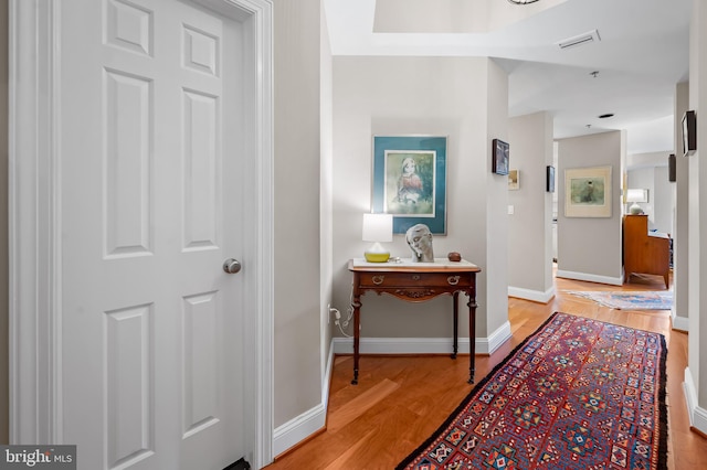 hall with light hardwood / wood-style floors