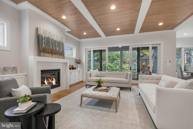 living room with a fireplace, french doors, light hardwood / wood-style floors, and wooden ceiling