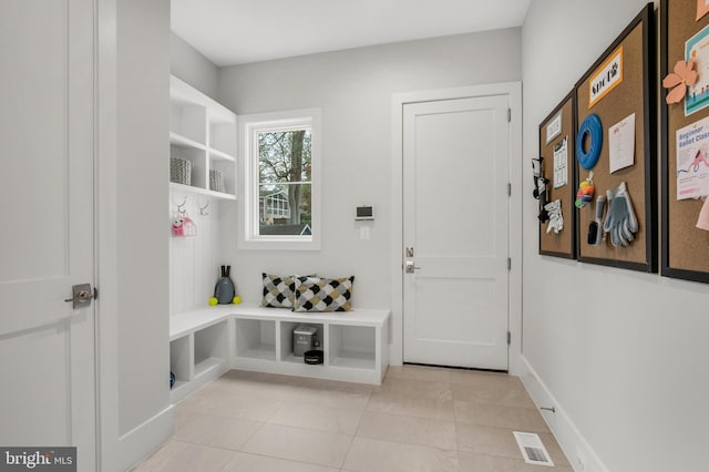 mudroom with light tile patterned flooring