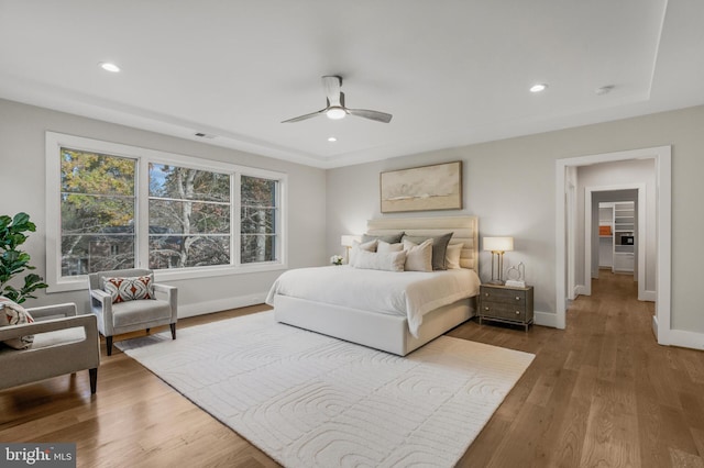 bedroom featuring hardwood / wood-style flooring and ceiling fan