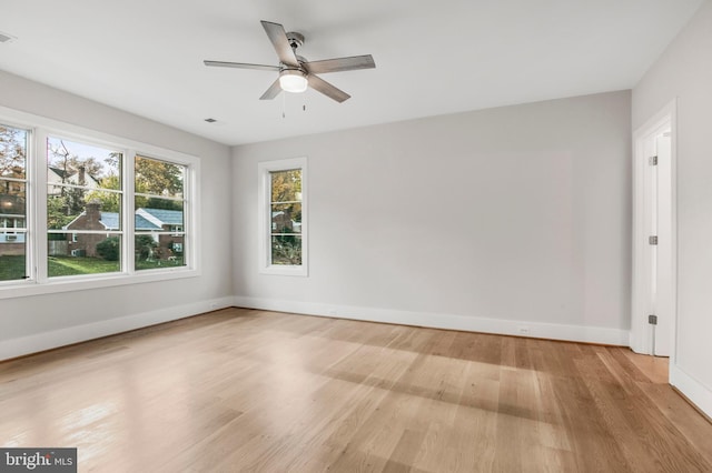 unfurnished room featuring ceiling fan and light hardwood / wood-style flooring