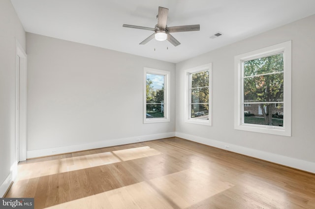 unfurnished room featuring ceiling fan and light hardwood / wood-style floors