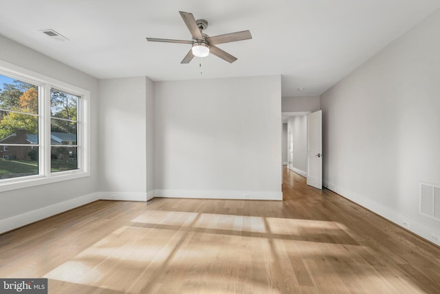 unfurnished room with ceiling fan and light hardwood / wood-style flooring