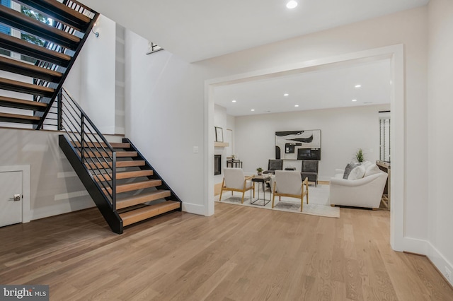 stairway with hardwood / wood-style floors