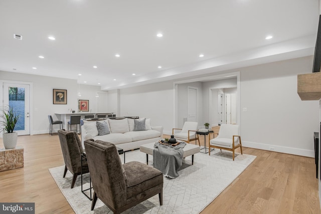 living room with light hardwood / wood-style floors