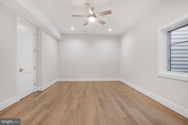 unfurnished room featuring ceiling fan and light wood-type flooring