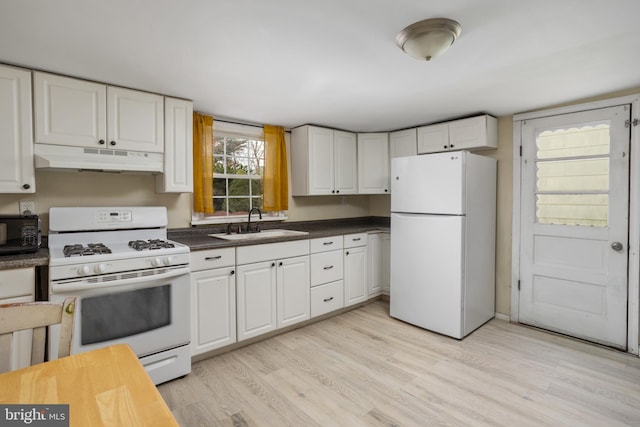 kitchen with white cabinets, light wood-type flooring, white appliances, and sink