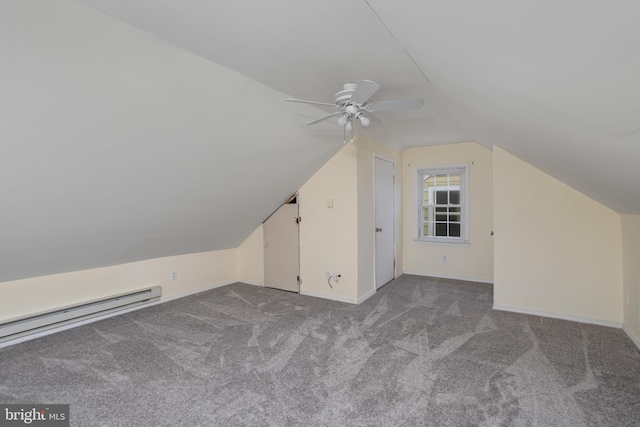 additional living space with ceiling fan, light colored carpet, baseboard heating, and vaulted ceiling