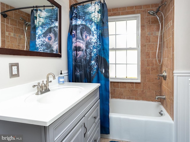 bathroom featuring shower / bath combination with curtain and vanity