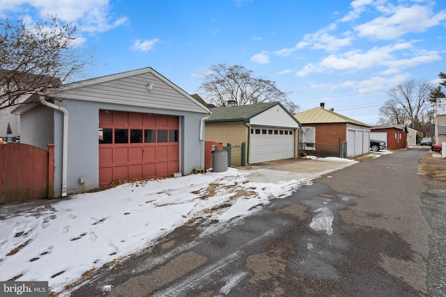 view of front of home with an outdoor structure and a garage